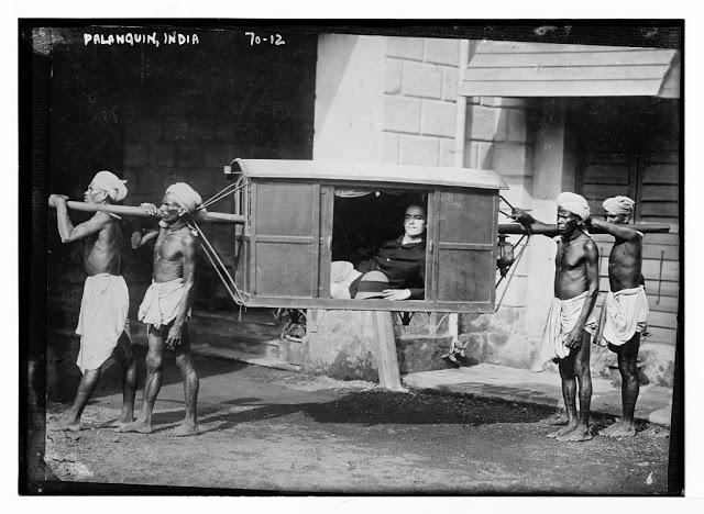 Four Indians Carrying Palanquin