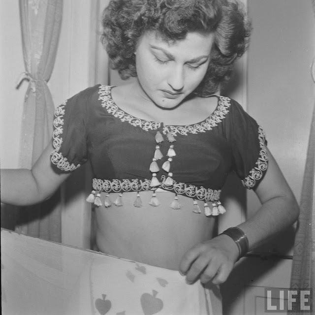 Hindi Movie Actress Begum Para Dressing in front of Mirror - 1951 Photoshoot by James Burke