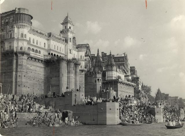 Hindu Pilgrims on the ghats on Ganges River at Banaras (Varanasi) under walls of palace during a festival - c1940-50's