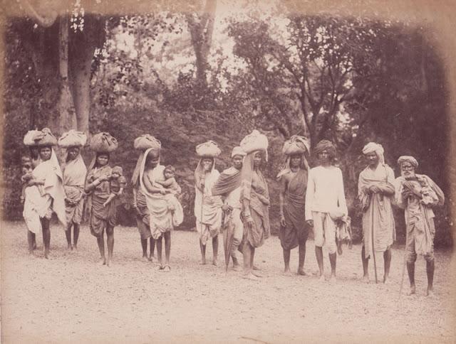 Natives of Central India carrying small packs on their head